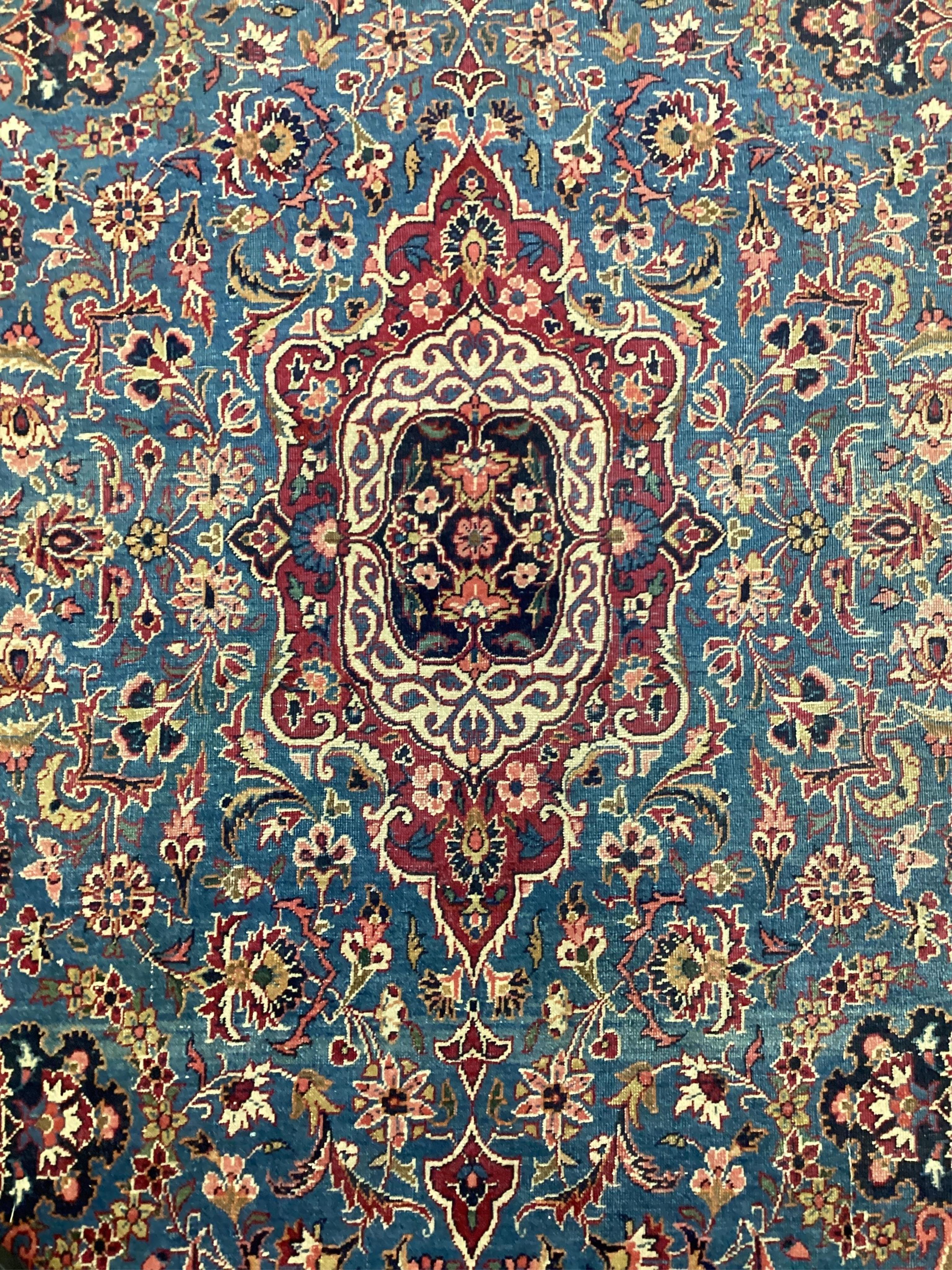A Kashan blue ground rug, 214 x 128cm. Condition - fair